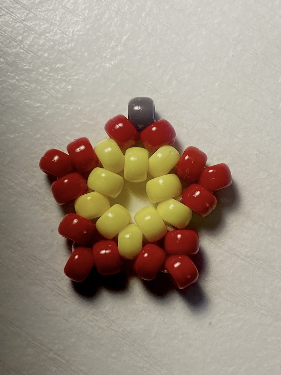 Star-shaped bead charm in red and yellow